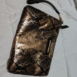 Gold snake print clutch with metal details